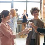 photo of people holding glasses